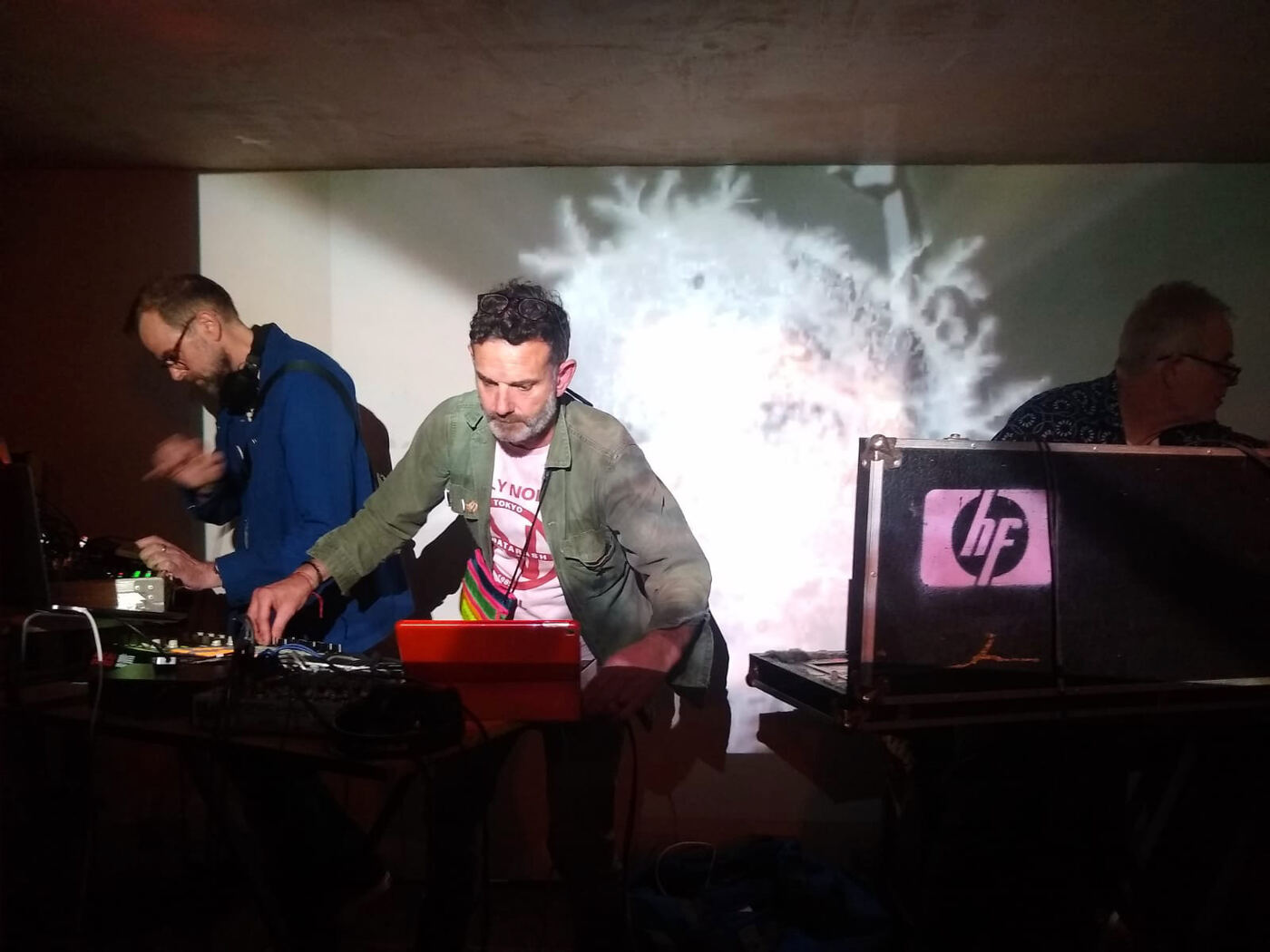 REEL performing live with a frost-like projection behind them